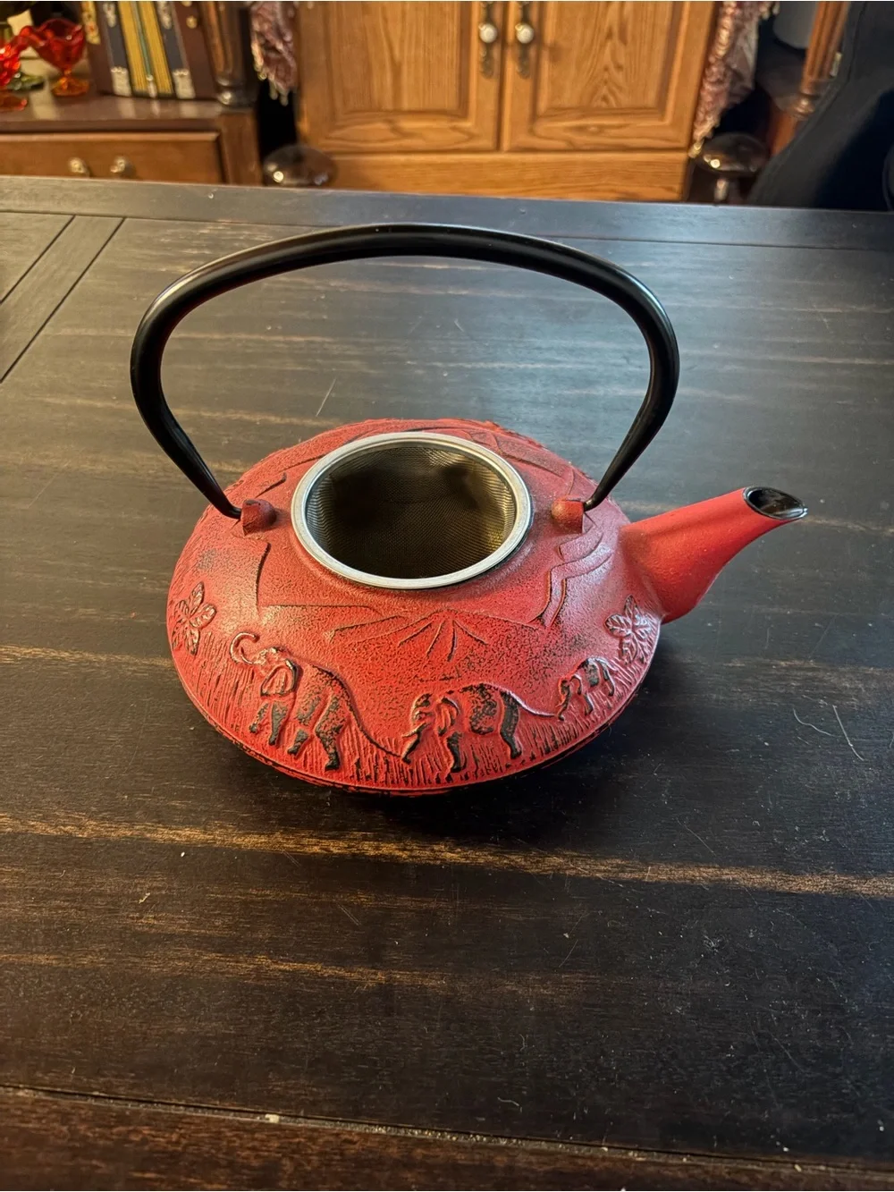 Red cast iron tea kettle